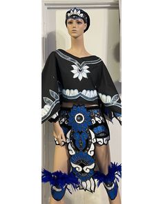 a mannequin dressed in blue and black clothing