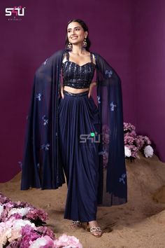 !! Designer Bollywood Collection!! Stylish navy blue Lehenga sari with choli and net jacket. Perfect outfit for Indian weddings or festivals. It is very comfortable and light weight yet stylish and elegant. Details: Blouse Fabric: Georgette Inner : Cotton lined Colour: Blue Sleeves: Sleeveless Embroidery : Cutdana, thread and sequins hand embroidery Lehenga/Skirt Fabric: Crepe Silk Inner : Cotton lined Colour : Blue Design: Ready to wear Lehenga skirt with pre plated saree style. Cape/Jacket  Fa Designer Wear Draped Dupatta With Mirror Work, Designer Draped Dupatta With Mirror Work, Designer Mirror Work Draped Dupatta, Navratri Draped Sets With Sheer Dupatta, Navratri Dupatta With Cutdana And Cape Sleeves, Navratri Reception Set With Traditional Drape, Cape Sleeves Anarkali Set With Cutdana For Eid, Navratri Designer Palazzo Set With Cape Sleeves, Eid Anarkali Draped Choli