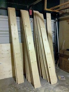 several pieces of wood sitting on the floor in a garage