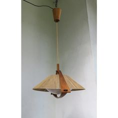 a wooden light fixture hanging from a ceiling