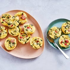 small muffins on a plate with a fork next to it and another plate full of muffins