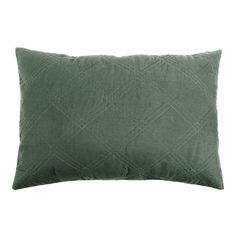 a green pillow with diamond design on the front and back, sitting on a white background