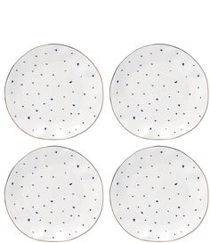 four white plates with blue speckles on them