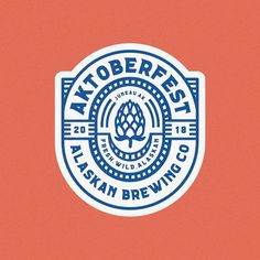 an oktoberfest sticker on a red background