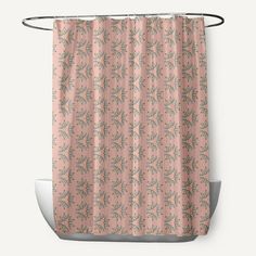 a pink shower curtain with green leaves on the bottom and grey trims, hanging from a metal rod