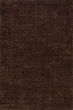 an area rug with dark brown colors