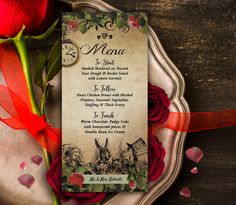 a menu card with red roses on a plate