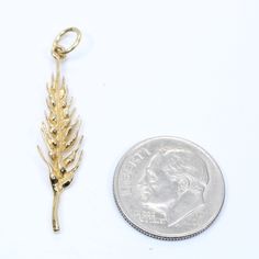 "4kt Gold Wheat Head Charm. Great Realistic Detail. I hand sculpted the original model for this piece out of wax trying to capture all of the realistic detail I could while still making it a functional wearable design. Size is 1 3/16\" tall by 1/4\" wide. Gold weight is 1.1 Grams. Available as a necklace here https://www.etsy.com/listing/503484077 Fast Shipping.. Most of my reviews have comments about how fast I ship. I usually ship out the item on the same day or by the next business day. Thank Wearables Design, Wheat, Wax, Yellow Gold, Personalized Items, Yellow, Drop Earrings, Gold