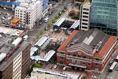 an aerial view of a city with tall buildings