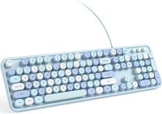 a computer keyboard sitting on top of a white surface with blue and white keys in front of it