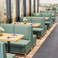 tables and chairs are lined up in a restaurant