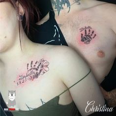 two people with tattoos on their chests and one has a hand print on it