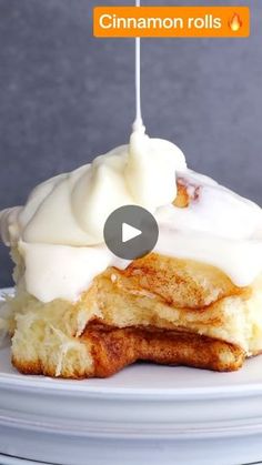 a white plate topped with pancakes covered in icing