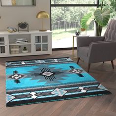 a living room with a blue rug and chairs