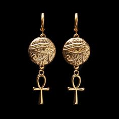 "Treat yourself or a loved one to these beautifully made earrings. The earrings are 1 3/8\" long (4.4cm). They are made of 24K gold plated brass and are expensive-looking. Choose the earrings quantity (single - 1 earring or a pair - 2 earrings) from the drop-down menu when you add items to the cart. For more of the Egypt theme jewelry: https://www.etsy.com/ca/shop/LeafOnWaterStudio?search_query=Egypt  You will receive your earrings carefully packed and ready to gift. I will include a message by request  ★ See all of our items at https://www.etsy.com/ca/shop/LeafOnWaterStudio ★ The sold jewelry is not made of solid gold and is only gold plated. To extend the life of your jewelry please keep it away from water and chemicals ★" Egyptian Style Jewelry, Nickel-free Ankh Gold Earrings, Engraved Metal Drop Earrings, Symbolic Metal Jewelry With Matching Earrings, Ankh-shaped Metal Earrings For Gift, Symbolic Pierced Dangle Jewelry, Ankh Shaped Metal Earrings For Gift, Symbolic Nickel-free Drop Plug Earrings, Nickel-free Symbolic Drop Plug Earrings