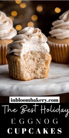 christmas eggnog cupcakes with white frosting on a marble platter