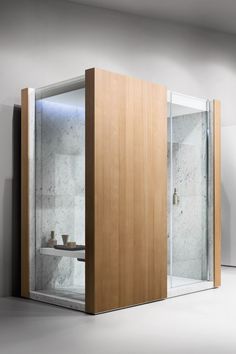 an open shower stall in a white room