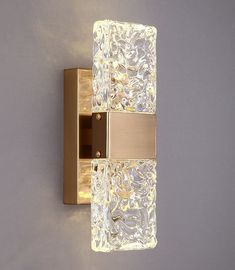 an image of a bathroom wall light with glass blocks on the front and back side