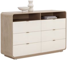 a white and brown dresser with two vases on it's top, next to a bowl