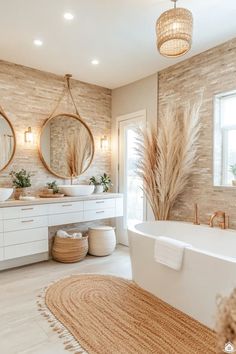 a bathroom with two sinks, a bathtub and mirrors on the wall above it