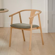 a wooden chair sitting on top of a hard wood floor