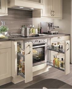 a kitchen with an oven, stove and counter top in it's cabinet space