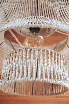 a close up of a light fixture on a wooden floor