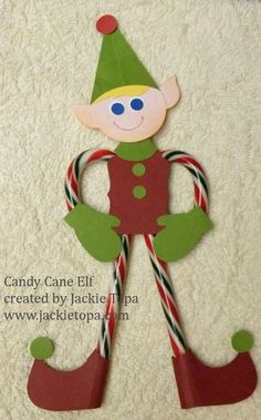 a paper elf with candy canes on it