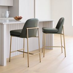 two chairs sitting next to each other in a kitchen