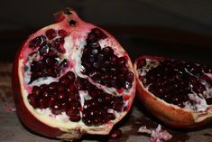 the pomegranate is cut in half and ready to be eaten