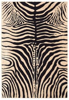 an animal print rug with black and white stripes