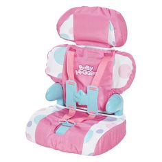 a child's booster seat with pink and blue polka dots on the front, attached to