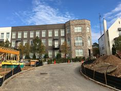 a large brick building sitting next to a construction site