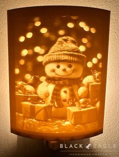 a night light with a snowman on it