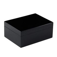 a black box sitting on top of a white surface