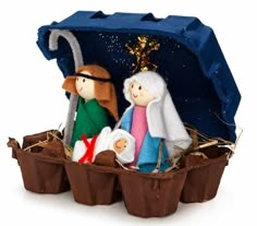 a nativity scene with three people in a manger