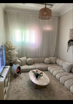 a living room filled with furniture and a flat screen tv