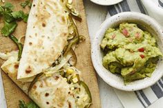 two quesadillas and a bowl of guacamole