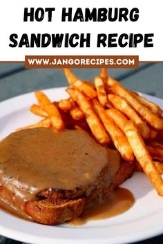 there is a sandwich and french fries on the plate with gravy over it