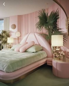 a pink bedroom with palm trees in the corner