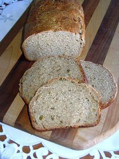 sliced bread sitting on top of a wooden cutting board