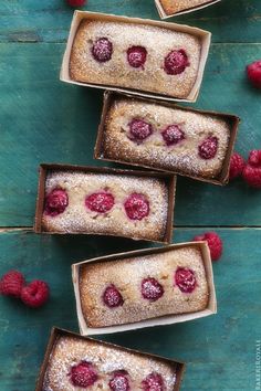 raspberry shortbreads with powdered sugar and fresh raspberries on top