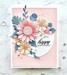 a birthday card with flowers on it