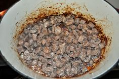 the food is being cooked in the pan on the stove