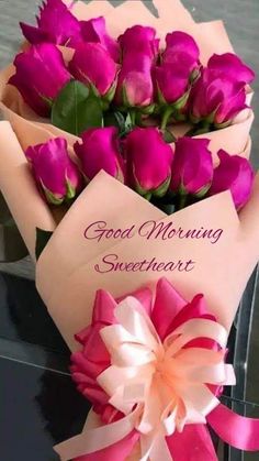 a bouquet of pink roses sitting on top of a table next to a card that says good morning sweetheart