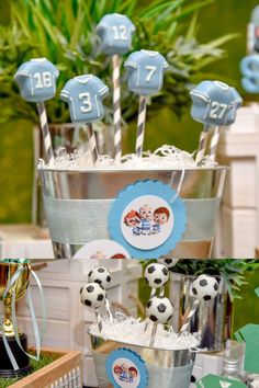 a table topped with lots of cupcakes covered in frosting and soccer decorations