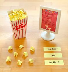 a popcorn box and some sticky notes on a table