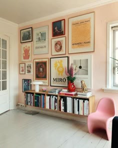 an instagram page with pictures on the wall and a pink chair next to it