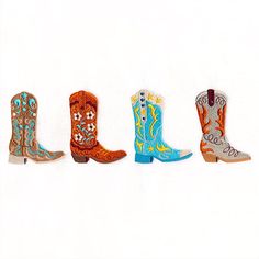 four pairs of cowboy boots are lined up in a row