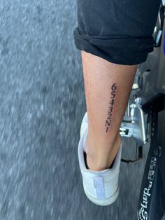 a person with a tattoo on their leg